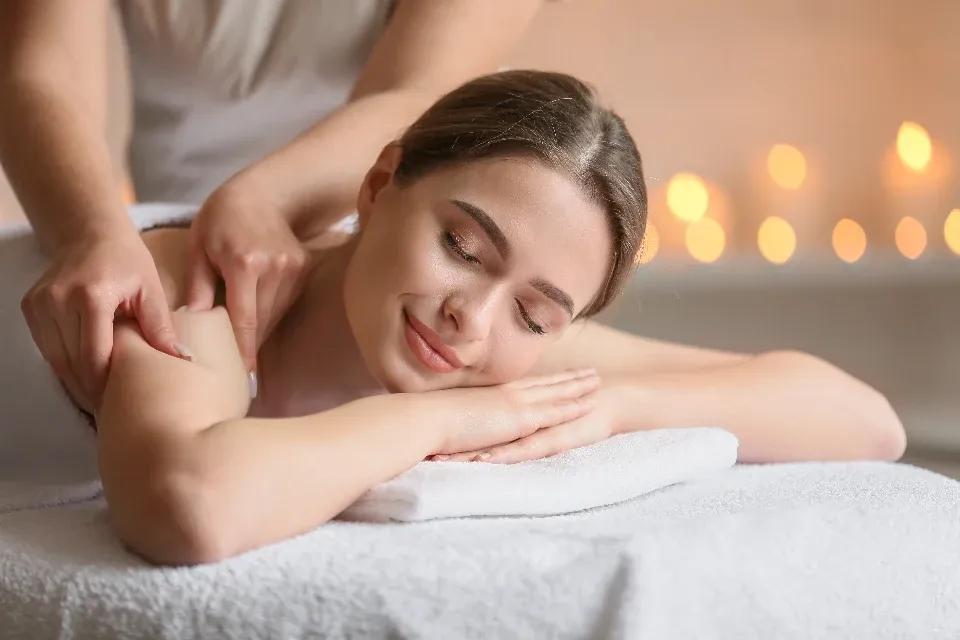 A woman relaxing during a back massage